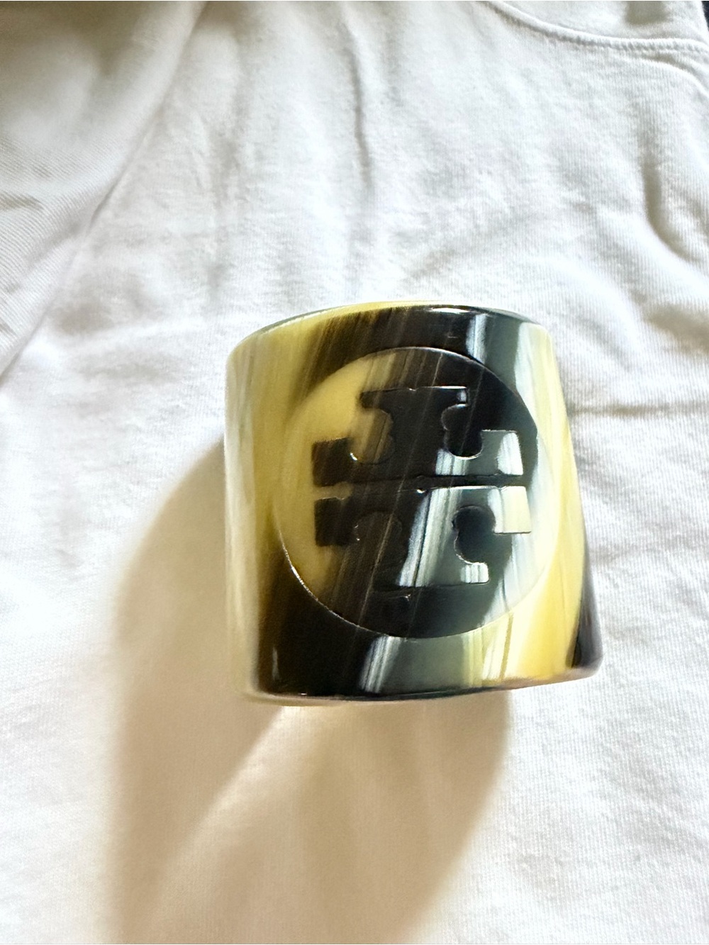 Tory Burch Black and Cream Swirl bracelet with Logo